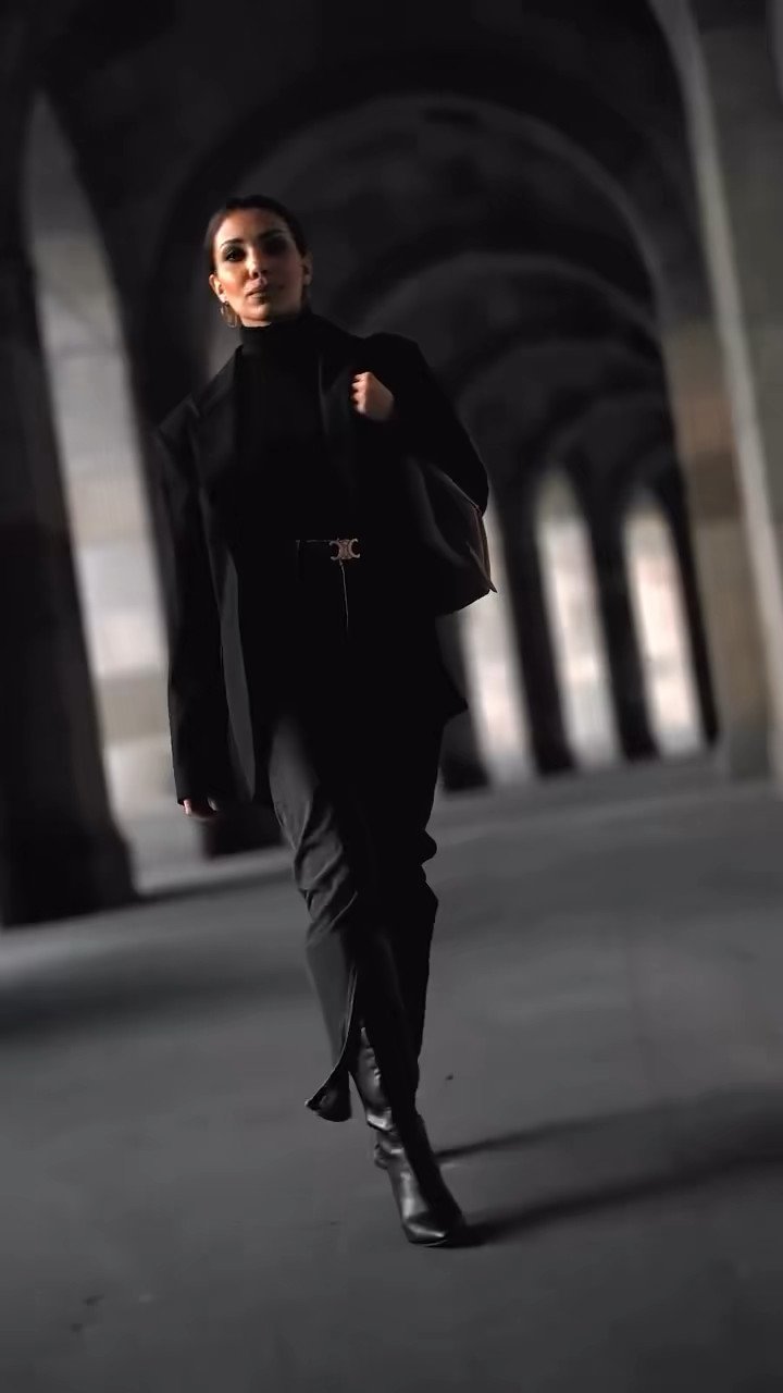 Fashion sequence in a dark colonnade