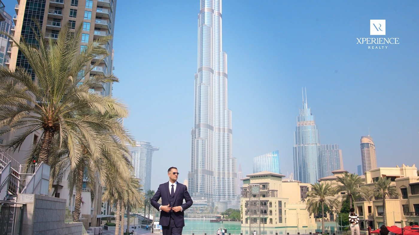 Property agent presenting with the Burj Khalifa behind